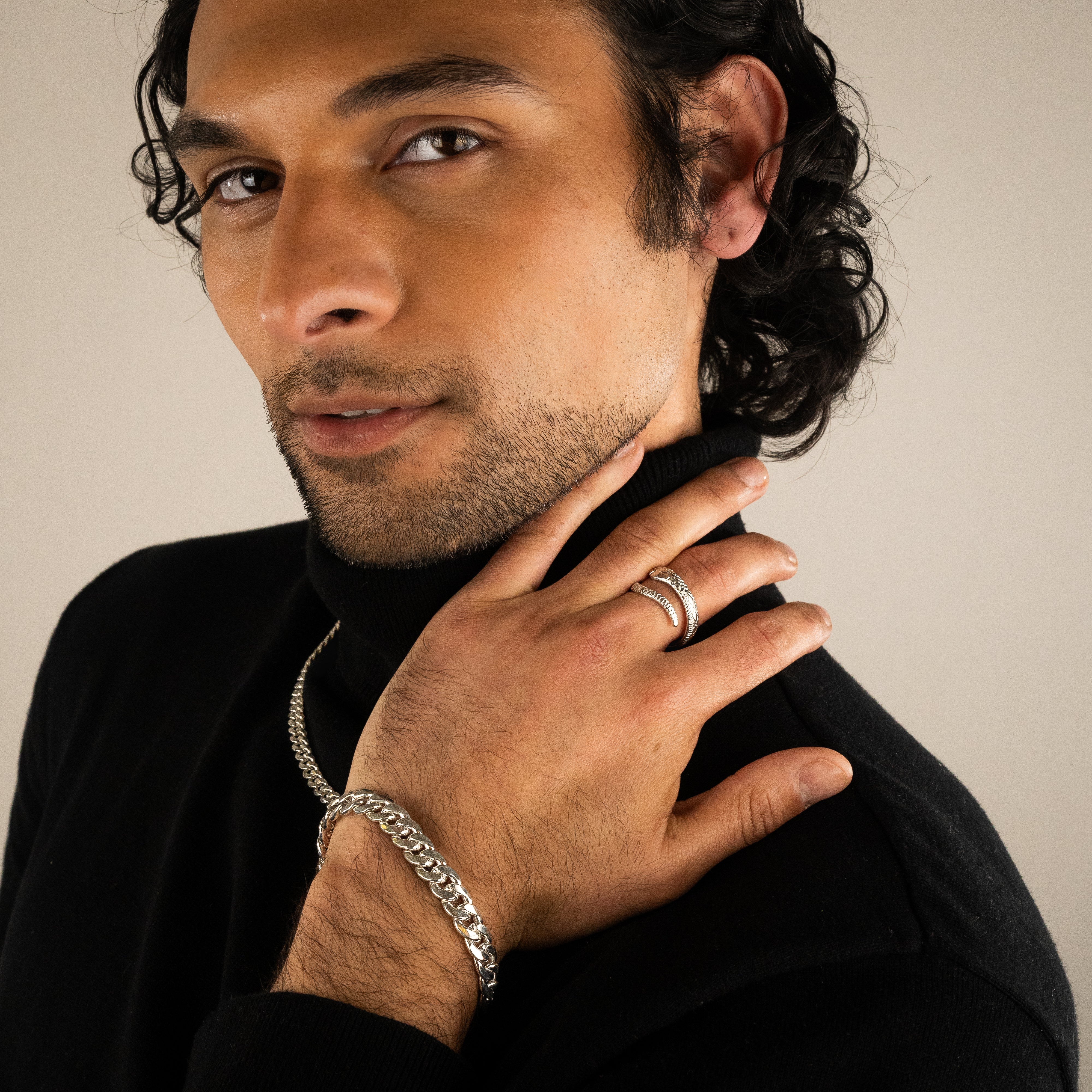 A model wearing the Ebnix silver bracelet styled solo on the wrist, highlighting its gender-neutral design and clean lines.
