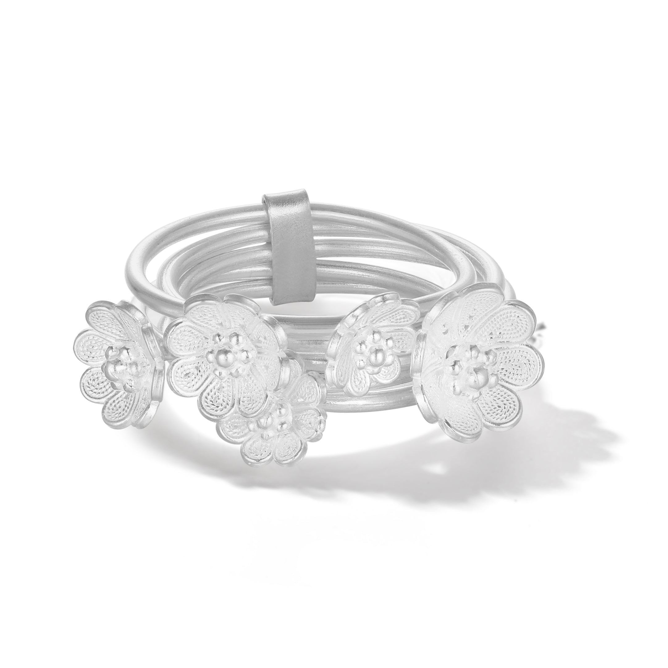 Close-up of delicate azalea flowers on the ring, each crafted in fine filigree silverwork that captures light and intricate beauty.