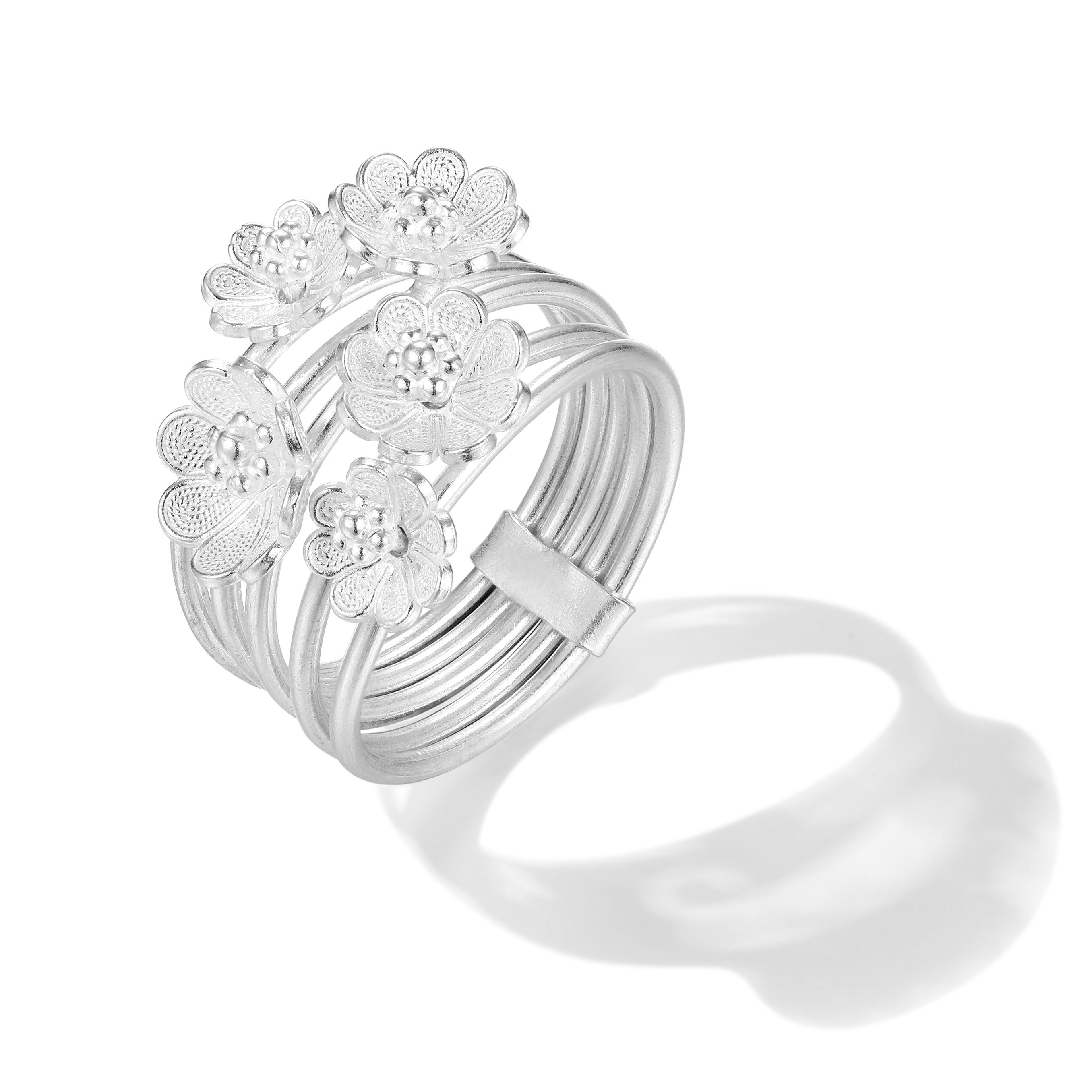 Full view of the Azalea Spin Ring featuring five intricately filigreed blossoms in fine 999 silver, stacked for timeless elegance.