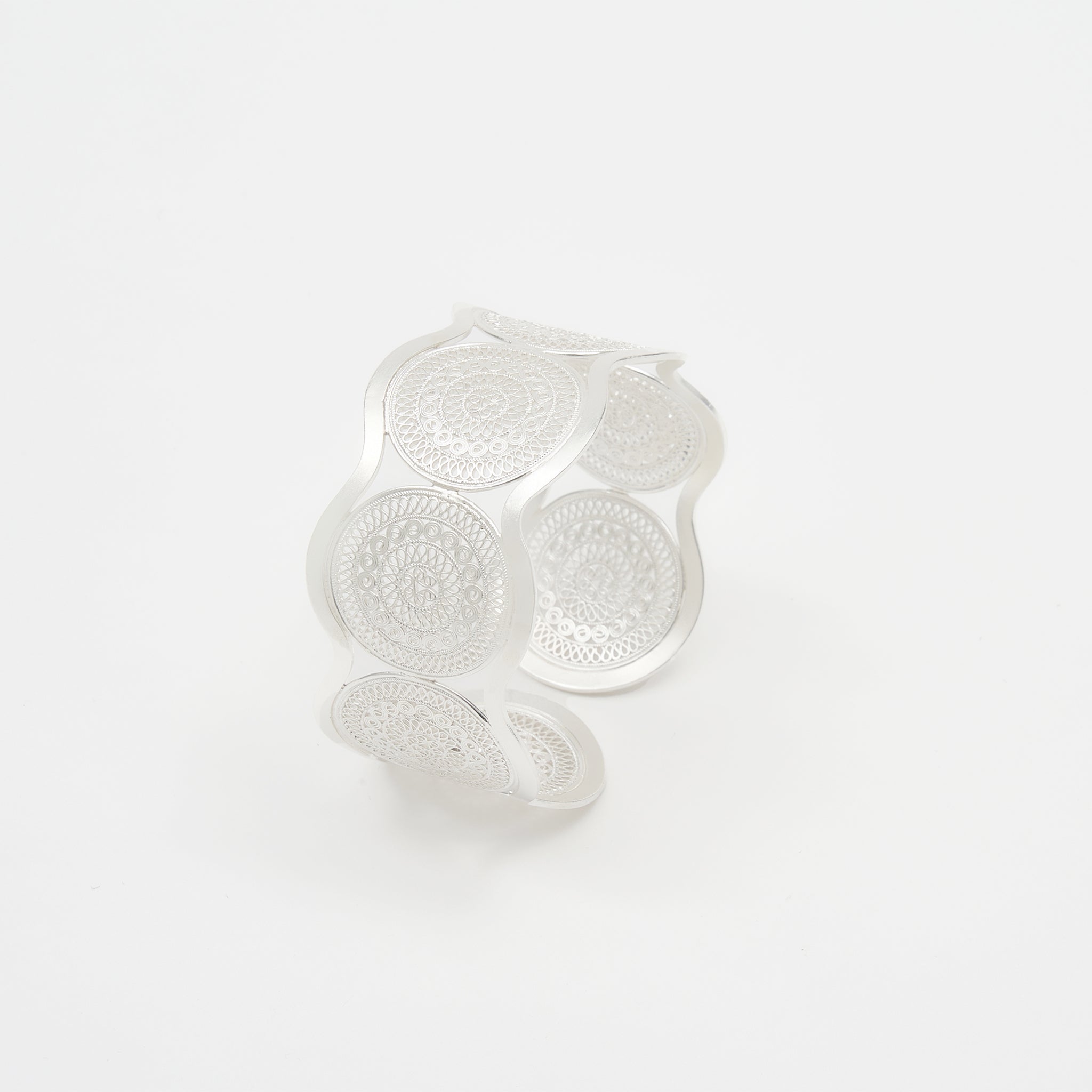 Full view of the EBNIX Lite Tempo Twist Bracelet showcasing seven silver drums